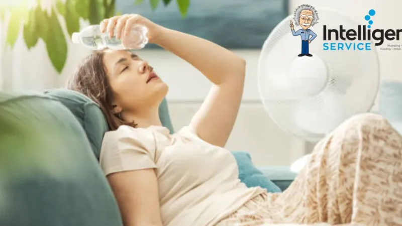 Woman cooling down with water bottle and fan in summer heat. Intelligent Service logo in the background.
