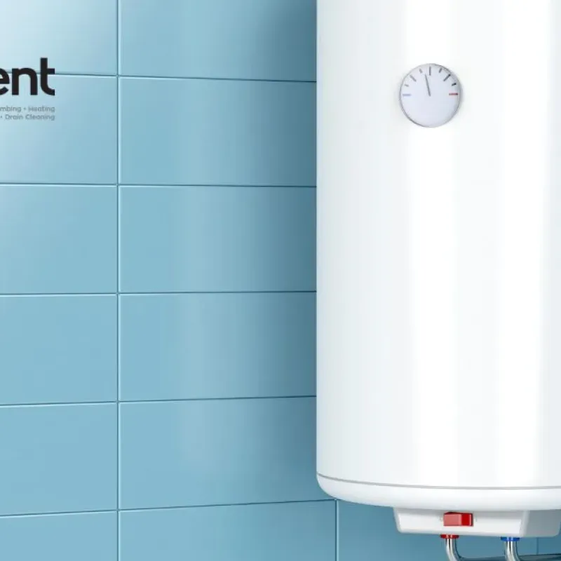 White water heater on blue tiled wall with Intelligent Service logo, offering plumbing and HVAC solutions.