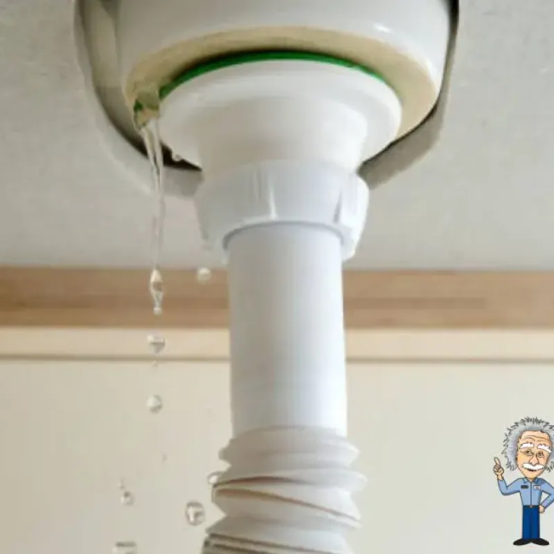 Leaking drain pipe under sink, highlighting plumbing issue with Intelligent Service logo.