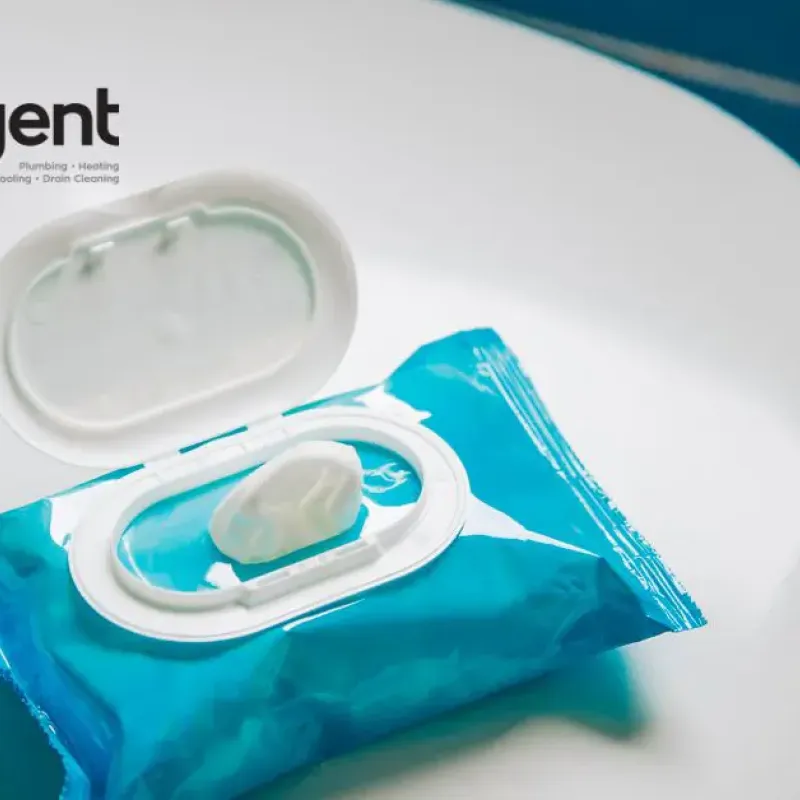 Open packet of disposable wipes on ceramic surface, Intelligent Service branding in background.